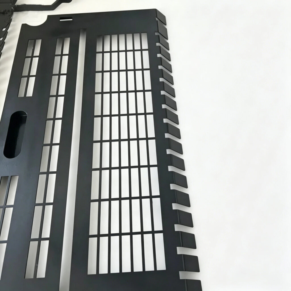 machine guard fabrication closeup black punched metal vent guard