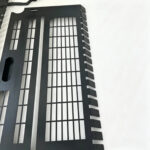 machine guard fabrication closeup black punched metal vent guard