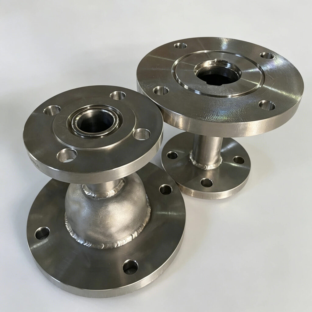 Custom titanium pipe reducer with welded flange connections
