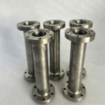 Titanium vacuum fitting with fully welded ConFlat flange assembly